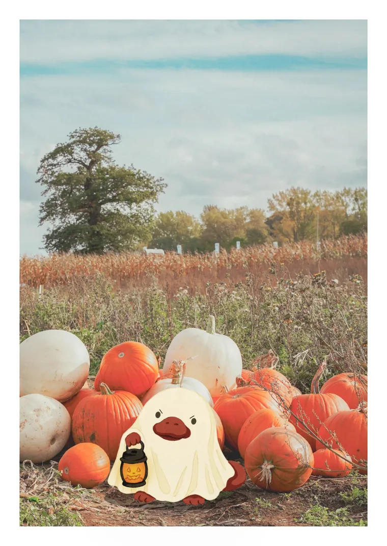 Postcard: Ploc as a ghost in a pumpkin patch